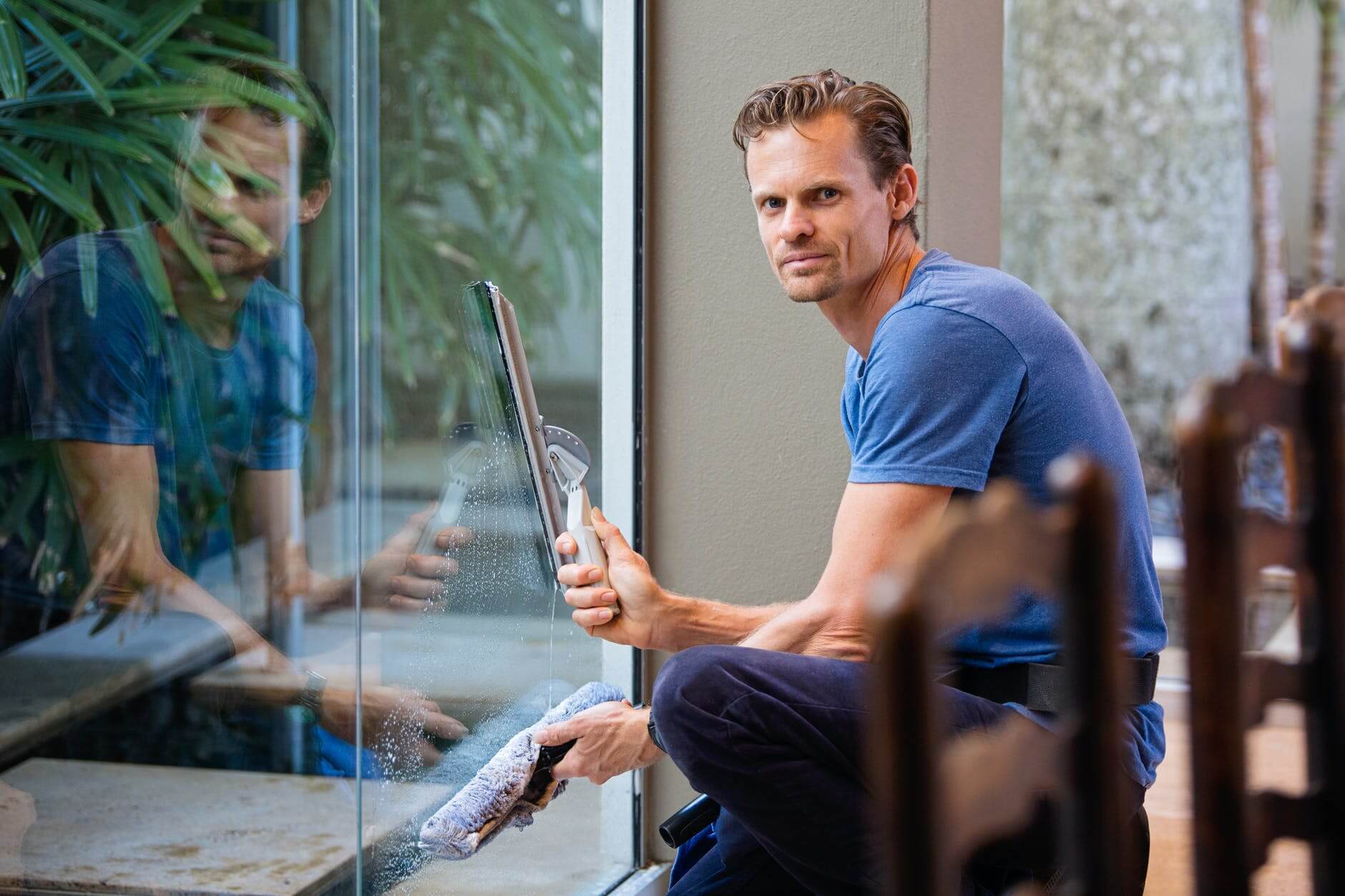 man cleaning window